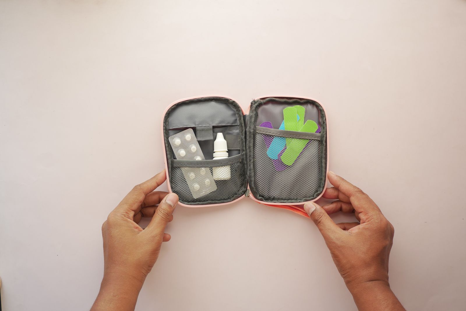 An open first aid kit filled with bandages and basic medical supplies